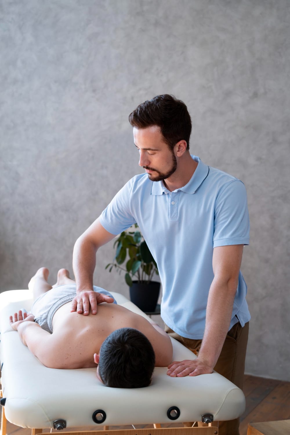 a man massaging a man's back